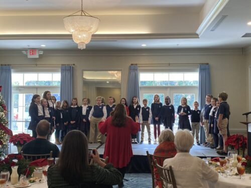 Mead Hall students singing for Episcopal Church Women of St. Thaddeus